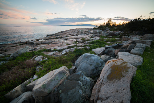 Sunset over a rocky coastline