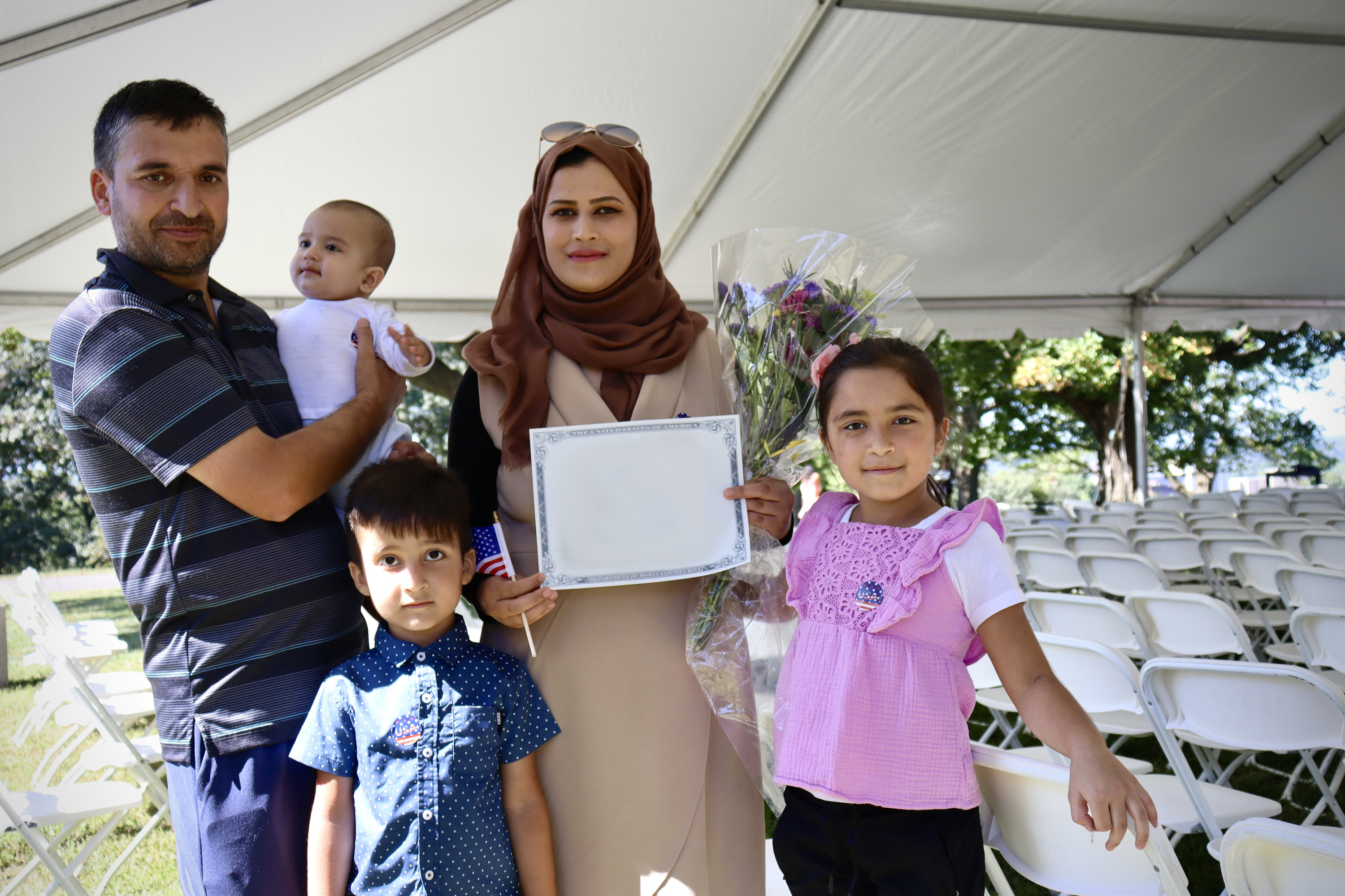 A family of five stands together after the cermeony