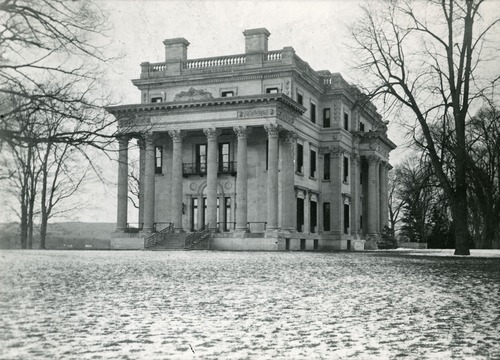 The Vanderbilt Mansion surrounded by light snow.