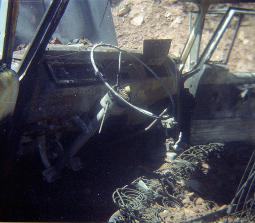 Color photo of an engine fire in a pickup.