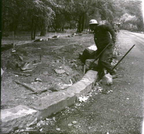 Man working on road construction along the scenic canyon drive near the Grotto.