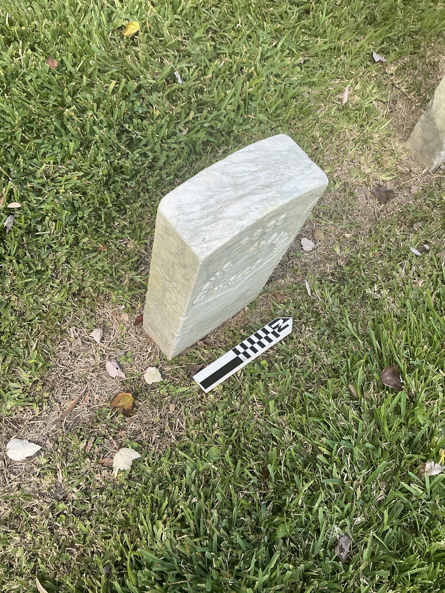 Extra image of historic upright marble headstone with recessed shield face.