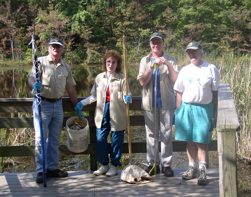 Volunteers cleaning the Sloan's Crossing Pond, MACA
