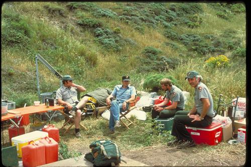 Park Rangers sitting in a temporary camp