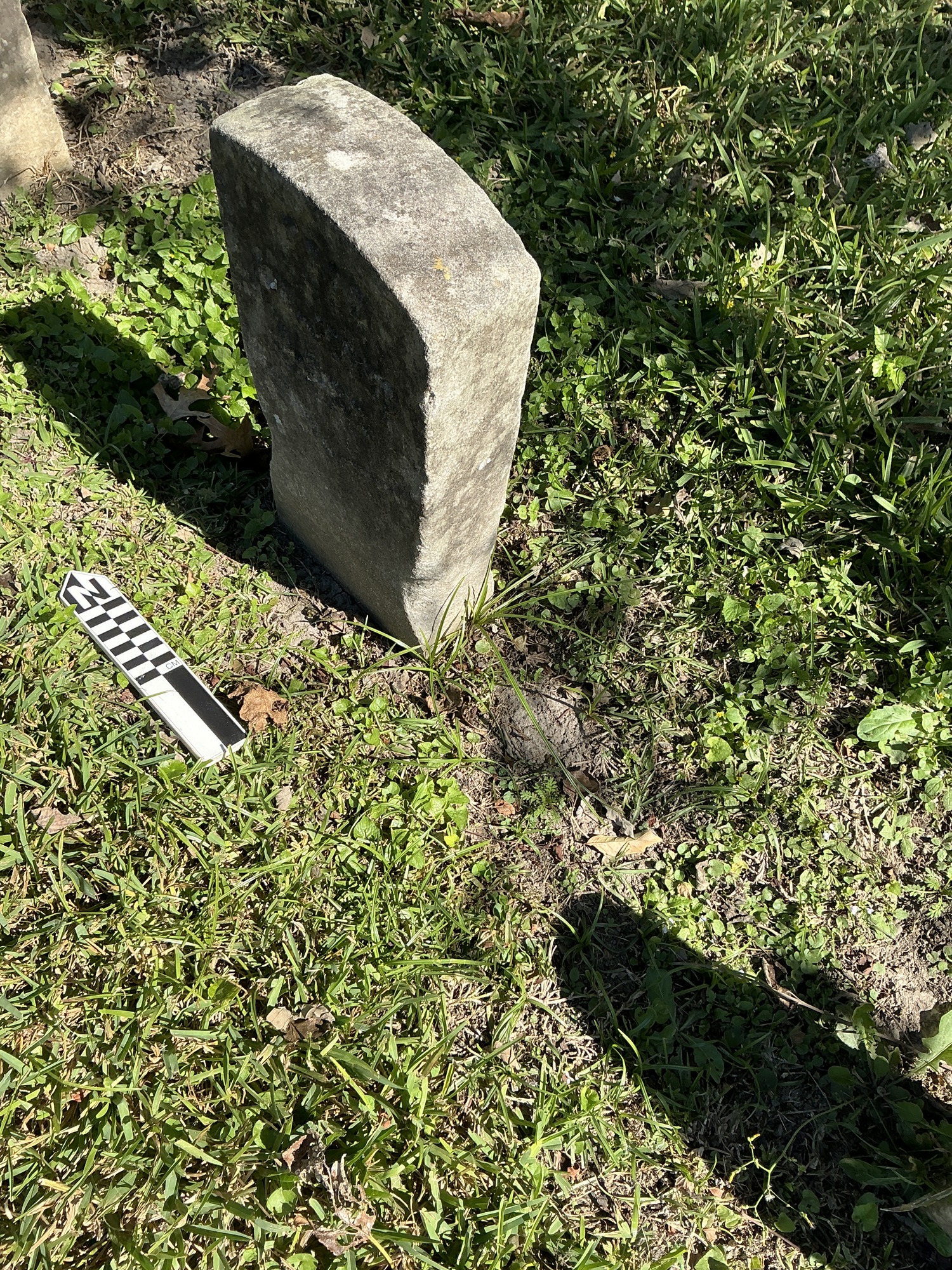 Extra image of historic upright marble headstone with recessed shield face.