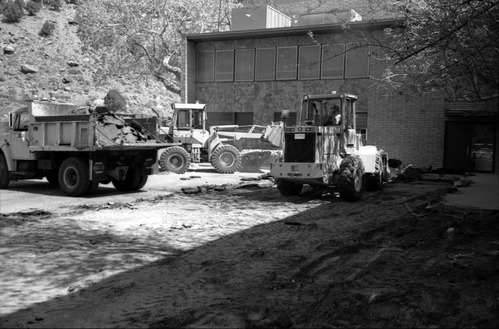Construction vehicles in operation during construction of headquarters addition.