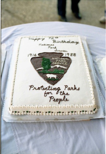 Color Photos of the parks 72nd anniversary celebrations- cake cutting, barbecue, speakers.