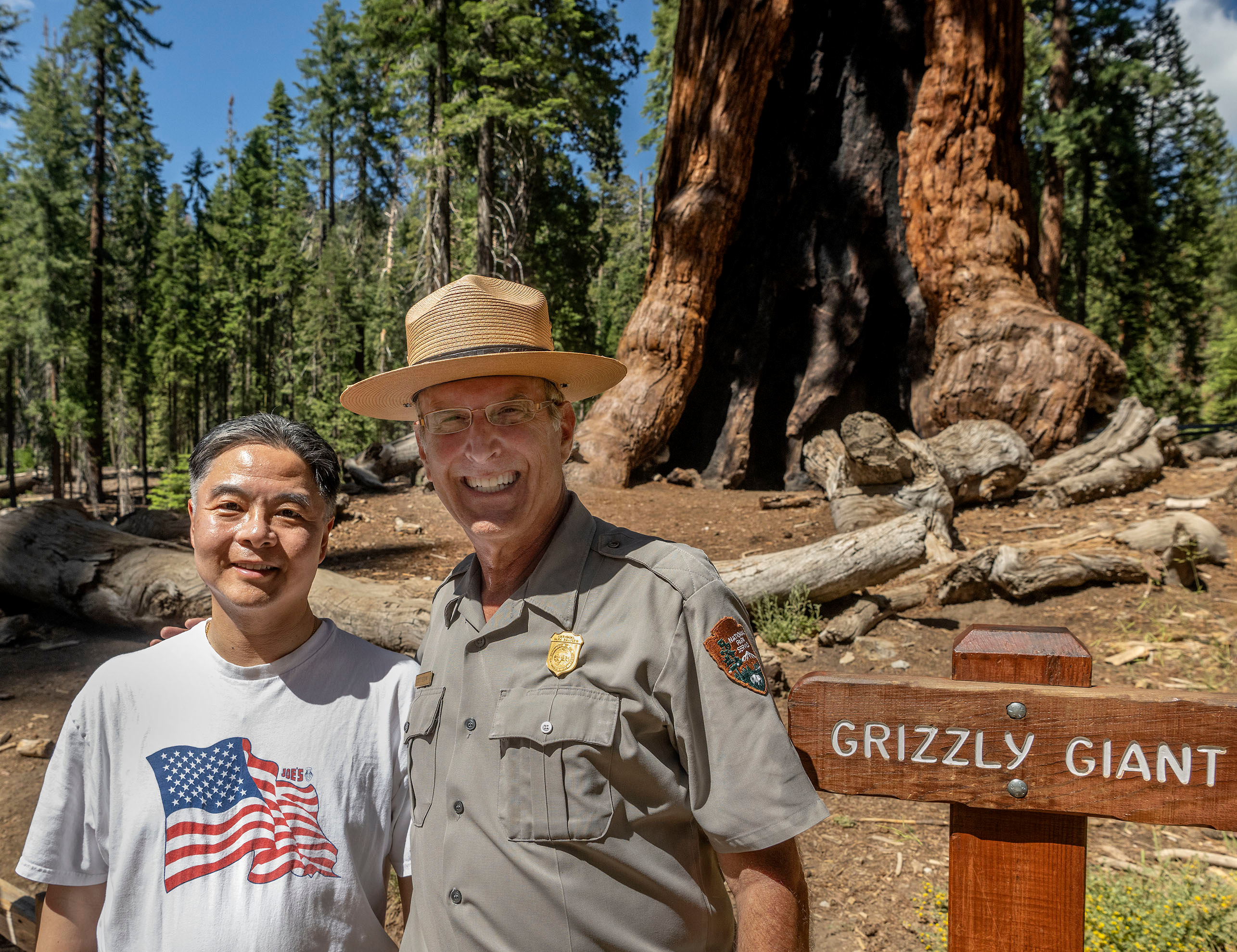 Scott Gediman and Congressional Delegation member in front of Grizzly Giant