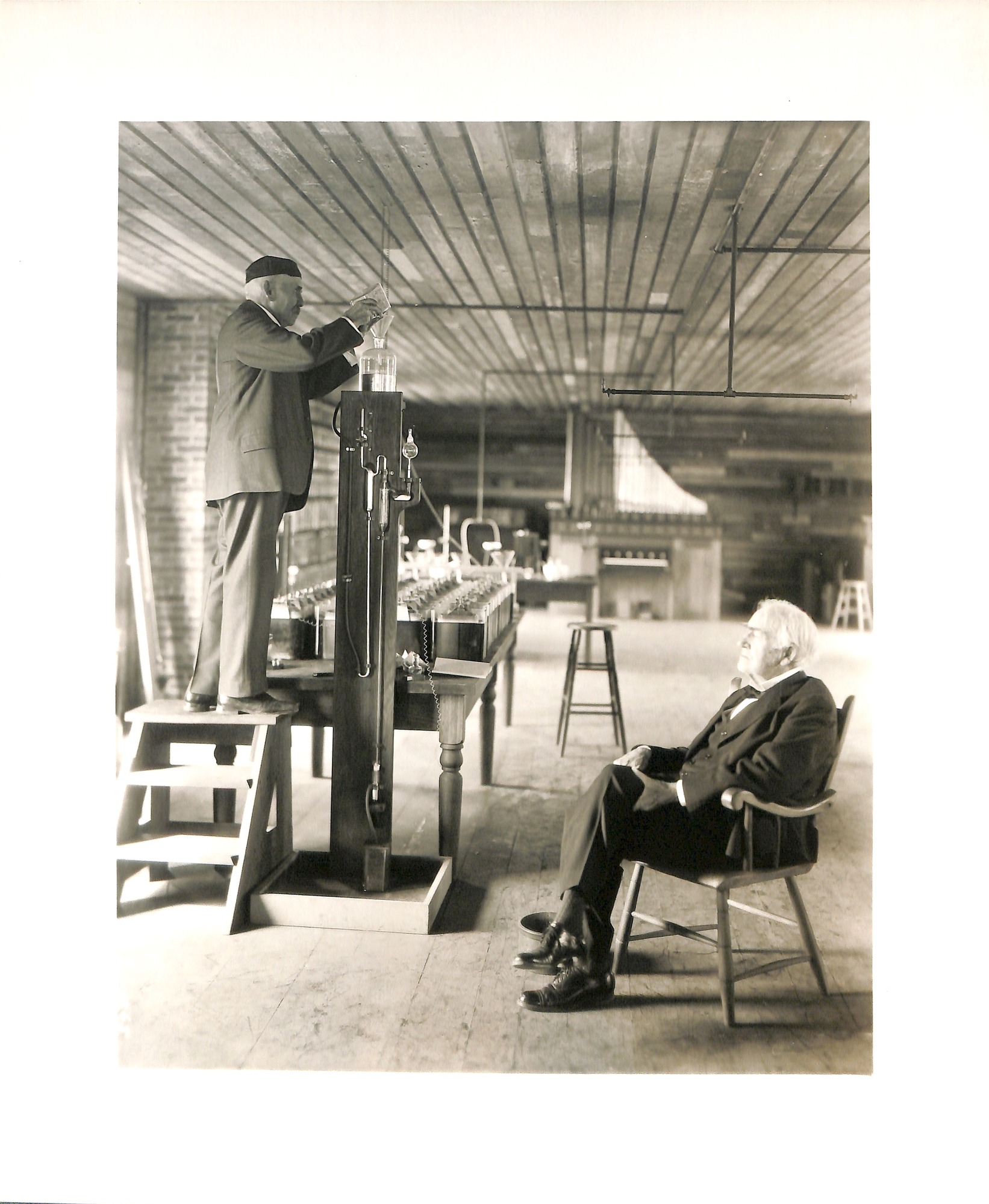 Thomas Edison and Francis Jehl with Sprengel pump at reconstructed Menlo Park lab in Dearborn, Michigan.