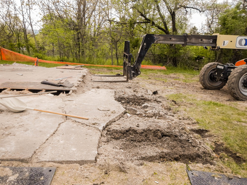 Telehandler is being used to remove the first floor deck for the former addition to the Wisler house.