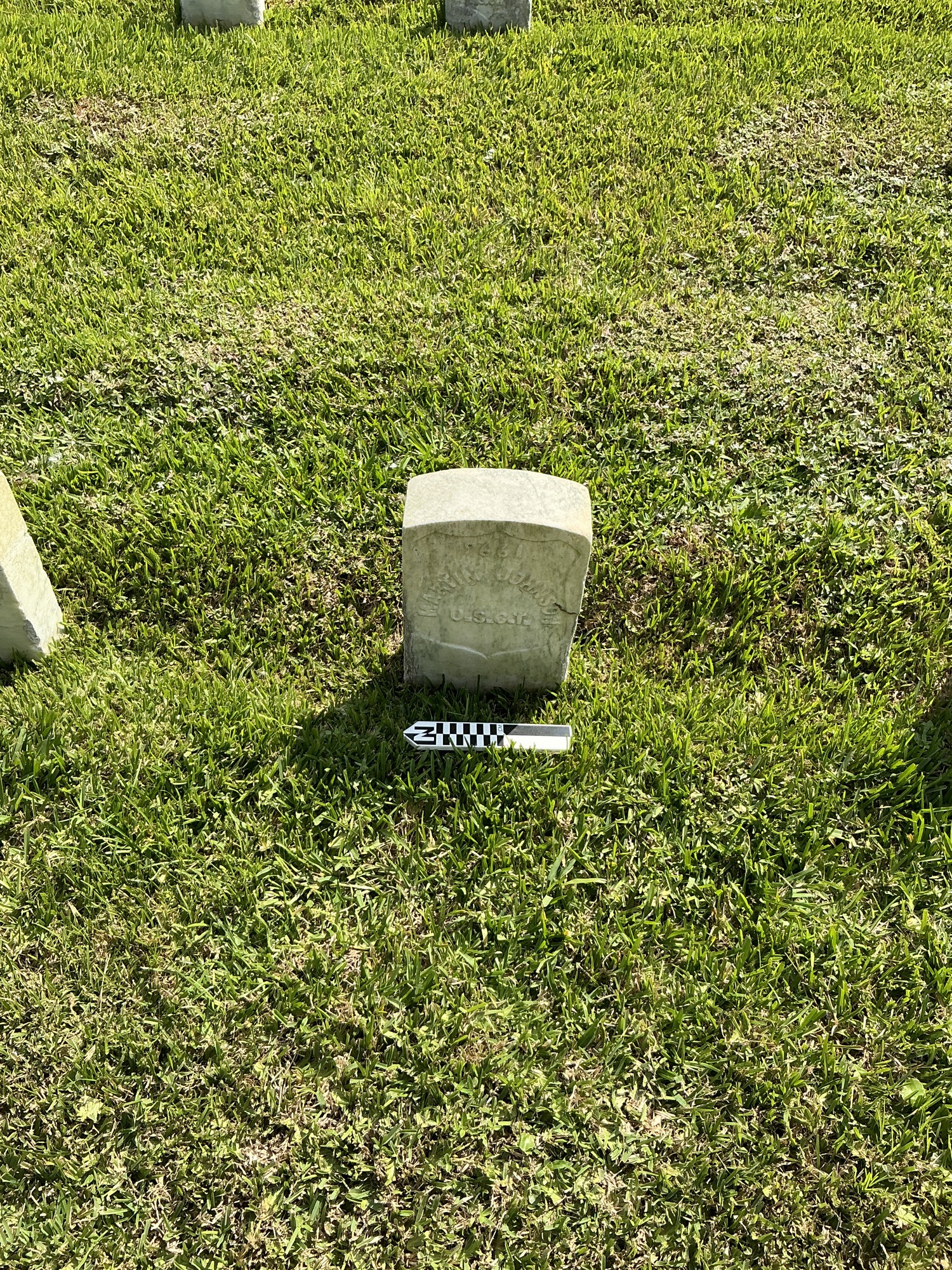 Extra image of historic upright marble headstone with recessed shield face.