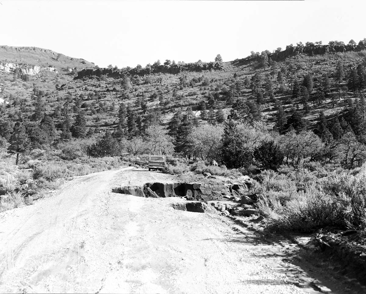 Flood damage - washed out culvert and portion of road near Maloney Hill, Kolob area.