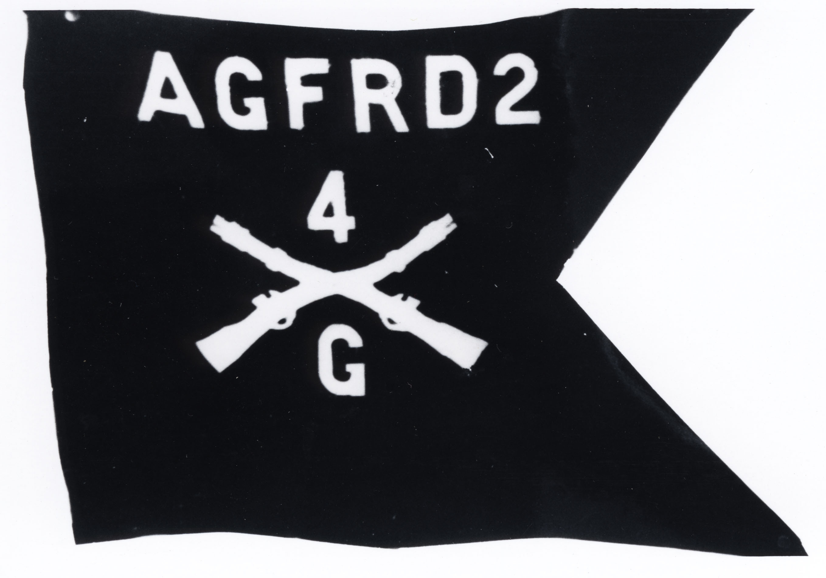 Black and white photograph of a guidon flag with text reading "AGFRD2" and two crossed rifles with "4" and "G"
