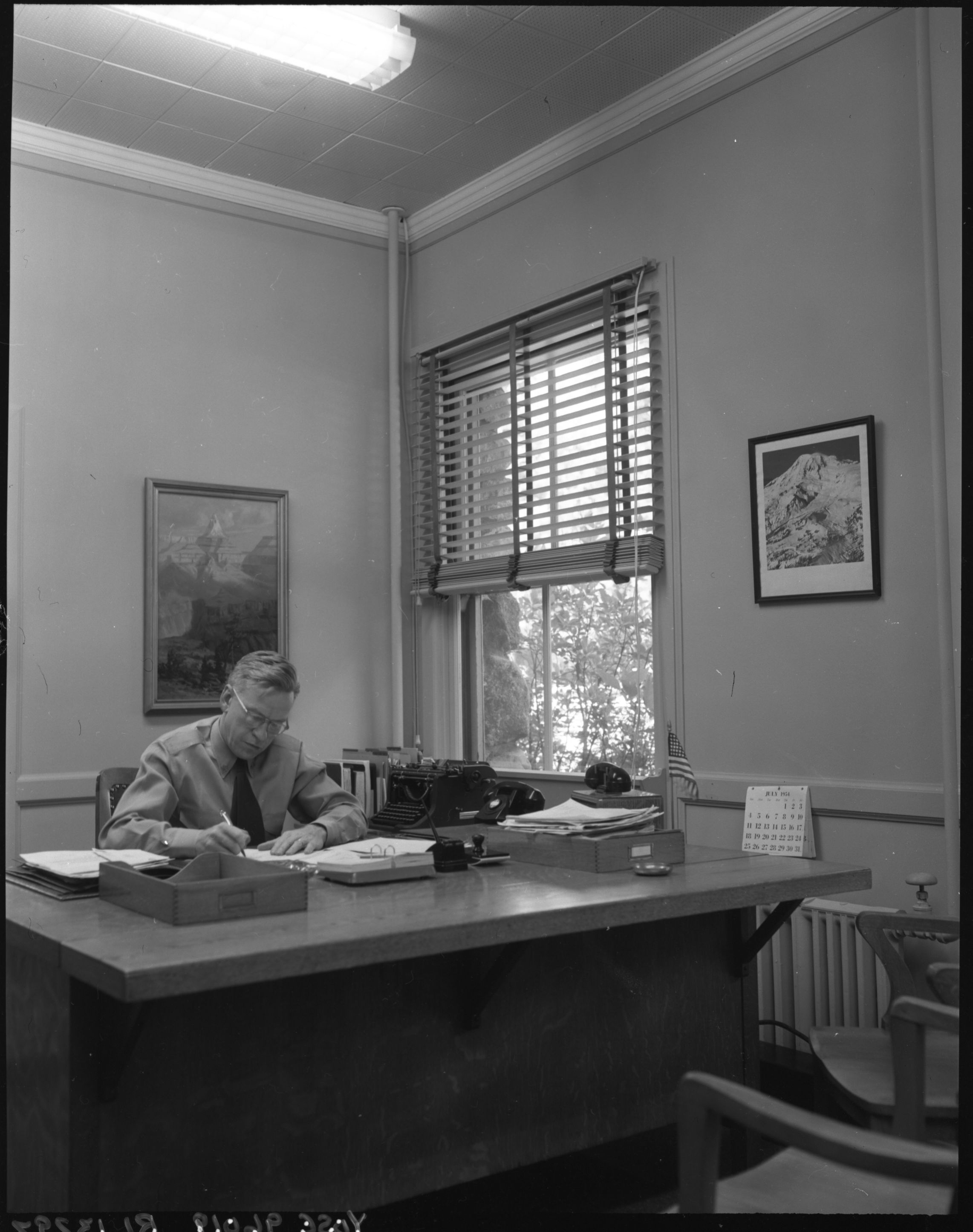 Assist. Supt. H.L. Bill in his office.