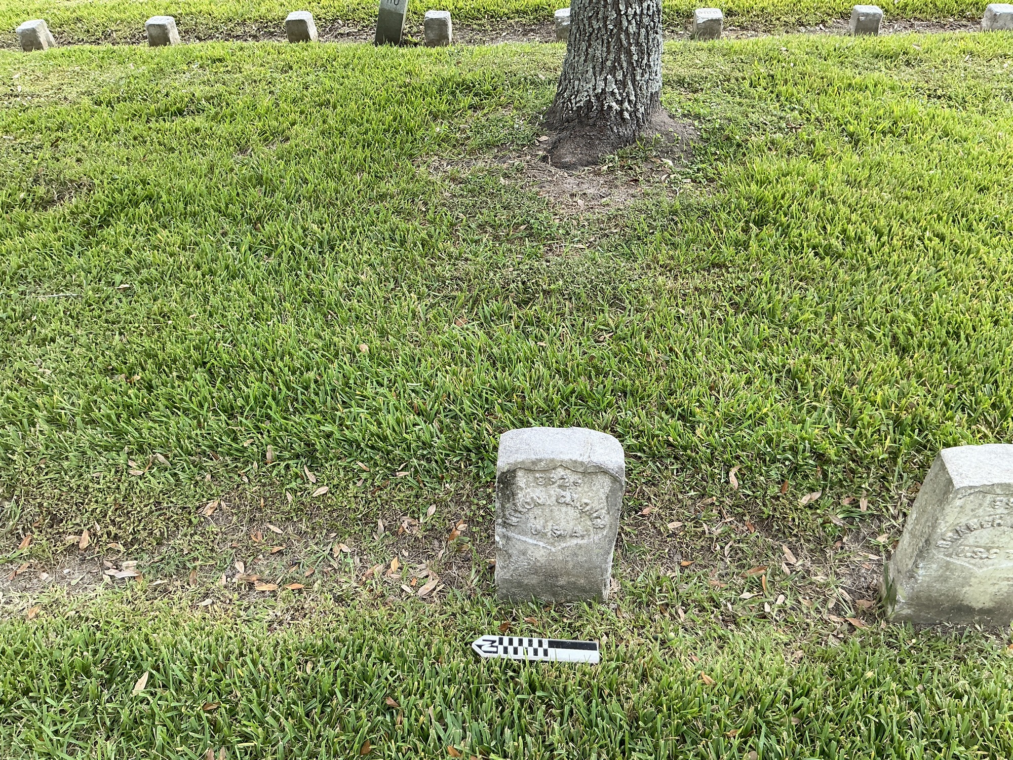 Extra image of historic upright marble headstone with recessed shield face.