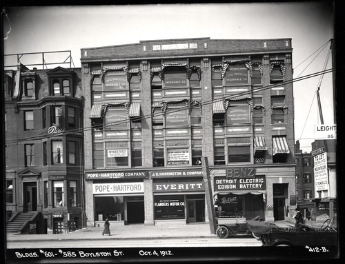 Four story building with window advertisements.