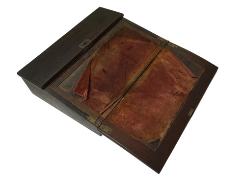 Dark wooden portable rectangular lap desk open to show slanted writing surface with maroon velvet cover.