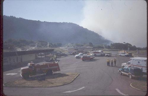 Firefighters provide structural protection to commercial buildings during the Bircher fire, Mesa Verde National Park, July 2000