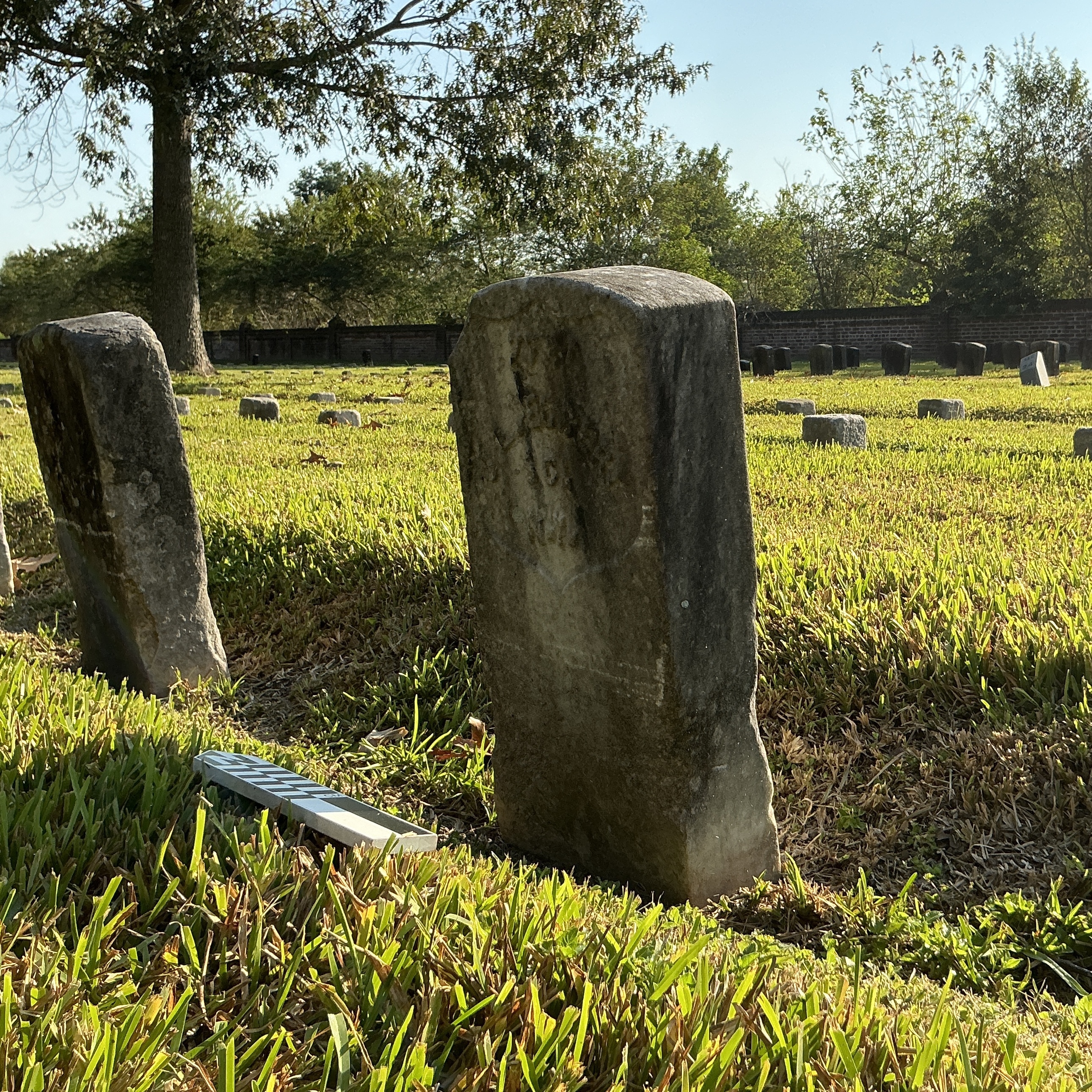Extra image of historic upright marble headstone with recessed shield face.