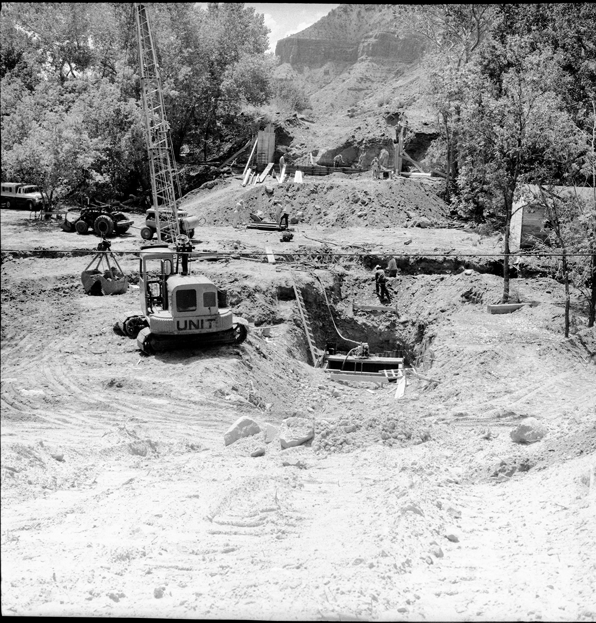 Building of piers and abutments for the Oak Creek Bridge on the new highway-State Route 15 (State Route 9), heavy equipment and crews.