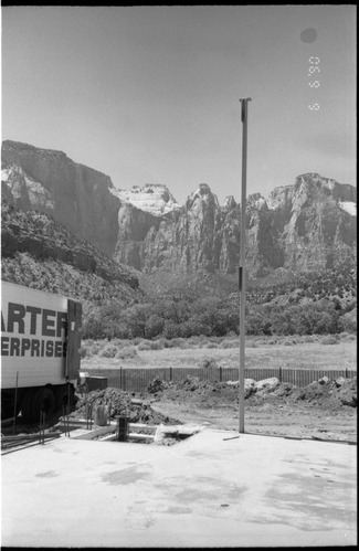 Pole and back of construction truck during construction of headquarters addition.