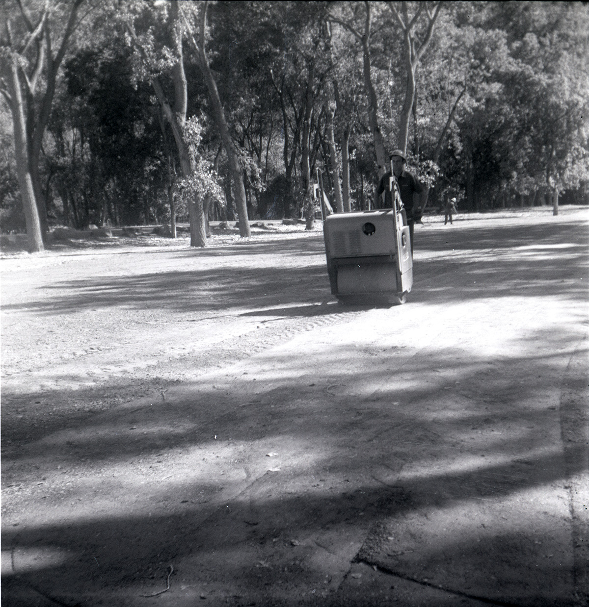 Man working on construction for the Grotto parking area.