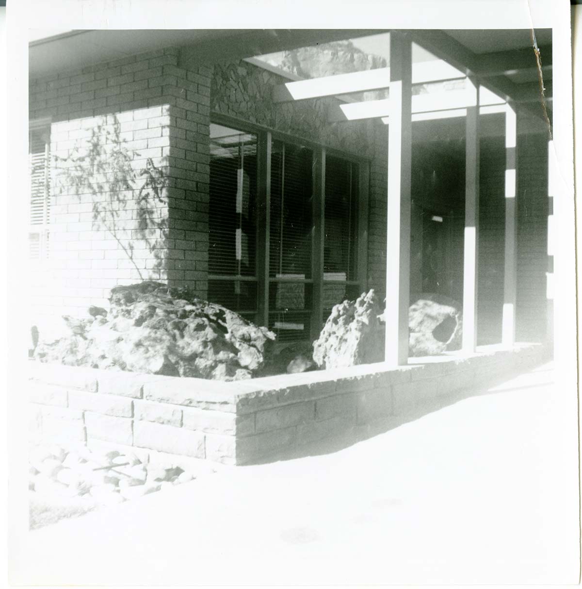 Raised garden bed filled with boulders located on the exterior of the old Mission 66 Visitor Center and Museum.