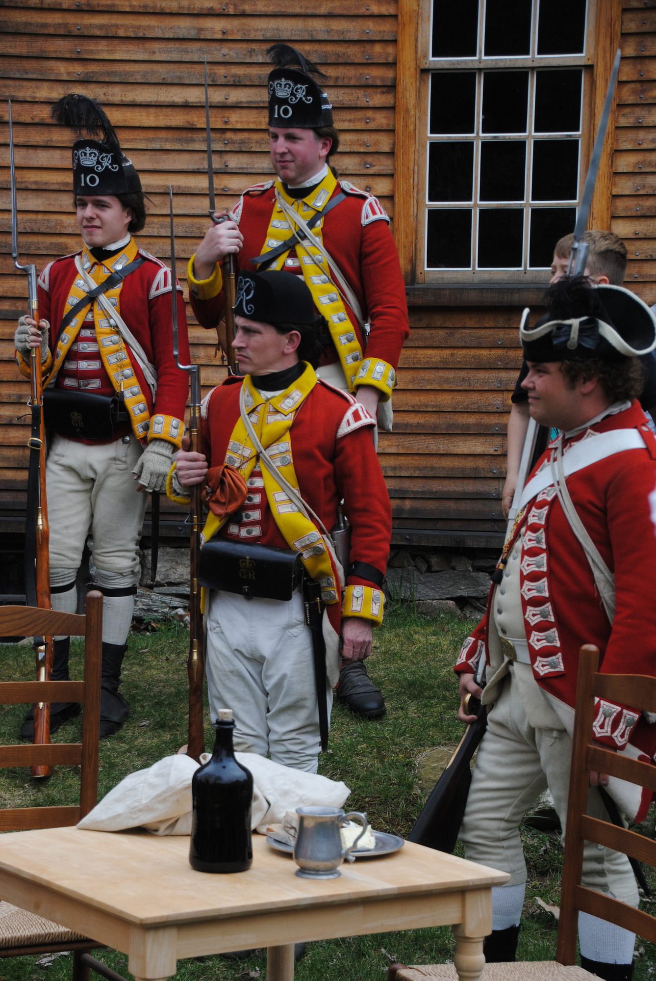 British soldiers at attention listening to officer
