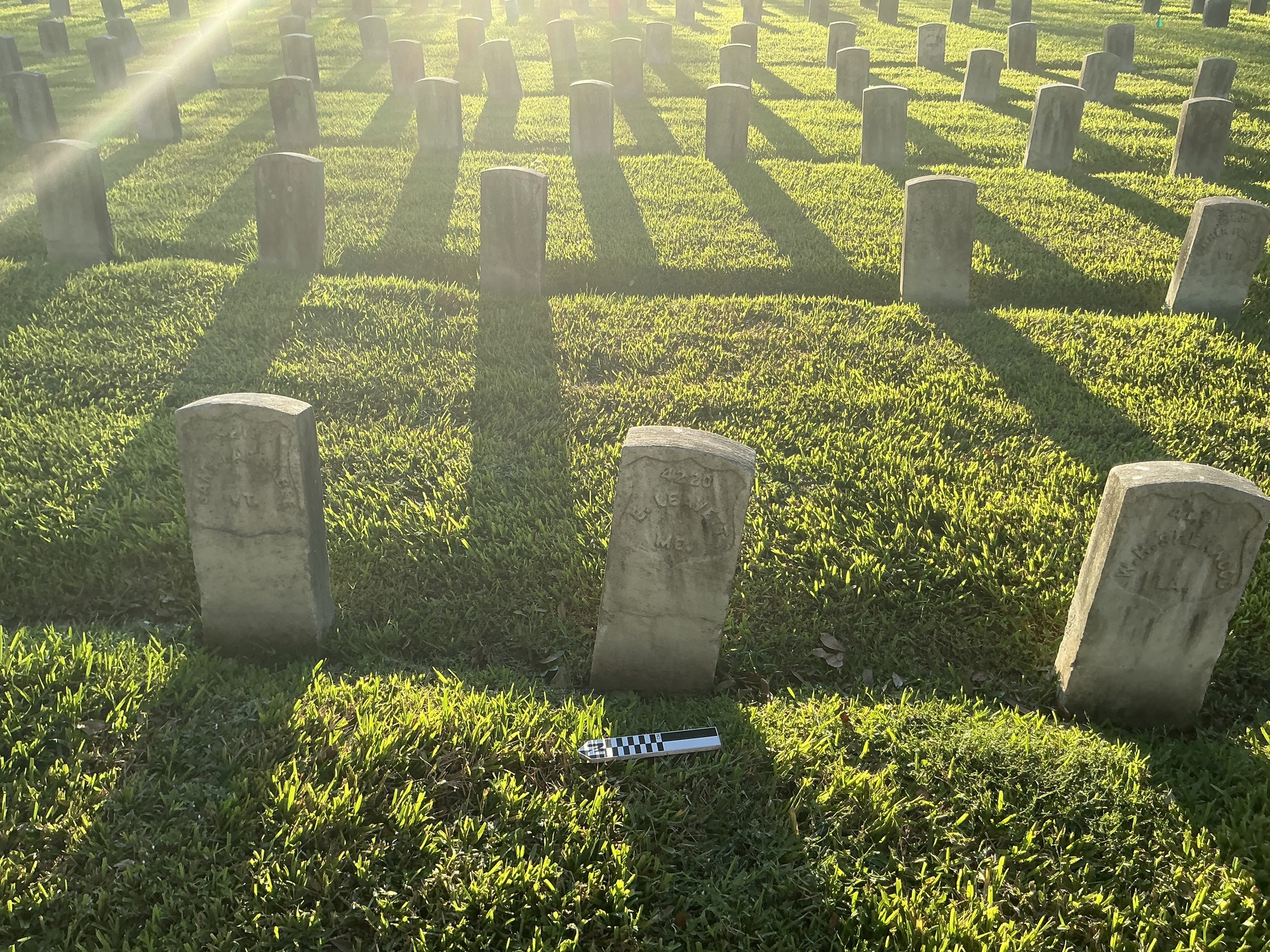 Extra image of historic upright marble headstone with recessed shield face.