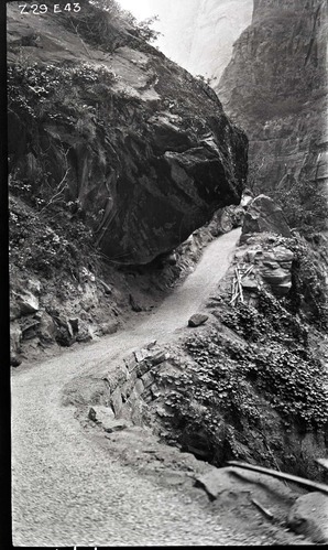 Narrows Trail construction, station 29-50, with view of dry wall, overhanging rock, and travertine limestone cut.