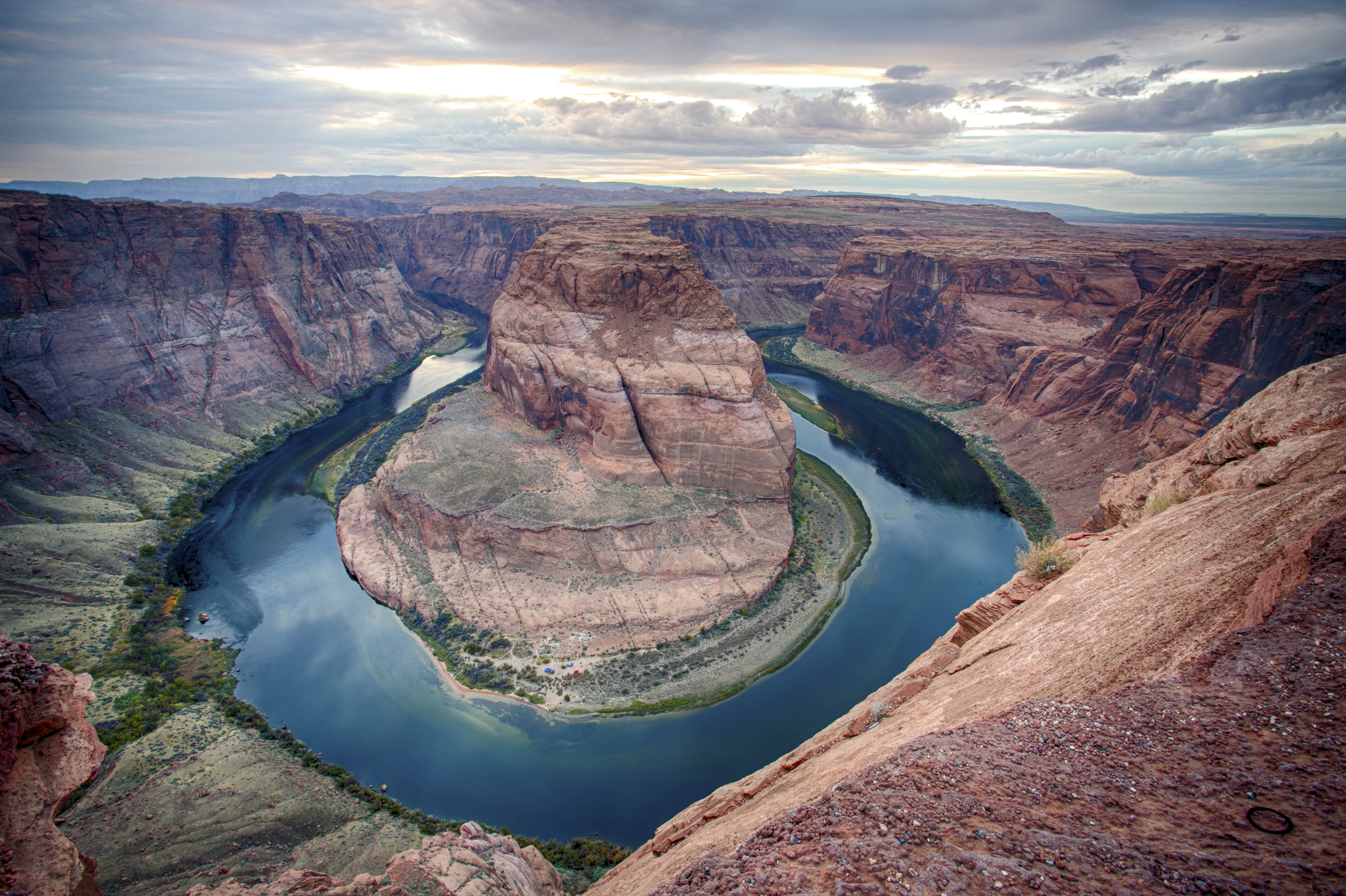Sandstone cliffs with river curved almost in a circle at bottom