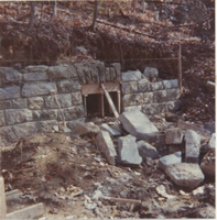 New masonry headwall partially completed