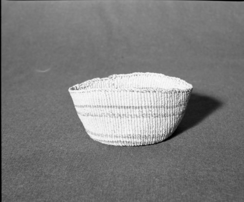 Marie Rozier Collection, Catalog No. 84. Object: Klamath/Modoc basket. Dimensions: 6" x 3 1/2". Materials: made entirely of tule stalk sheath. Technologoy: down to right slant of turns. Collection History: From Mrs. Kipling collection. Photographed by Michael Dixon, December 1982. Catalogued by Craig Bates and Barbara Beroza. Yosemite Collections, National Park Service.