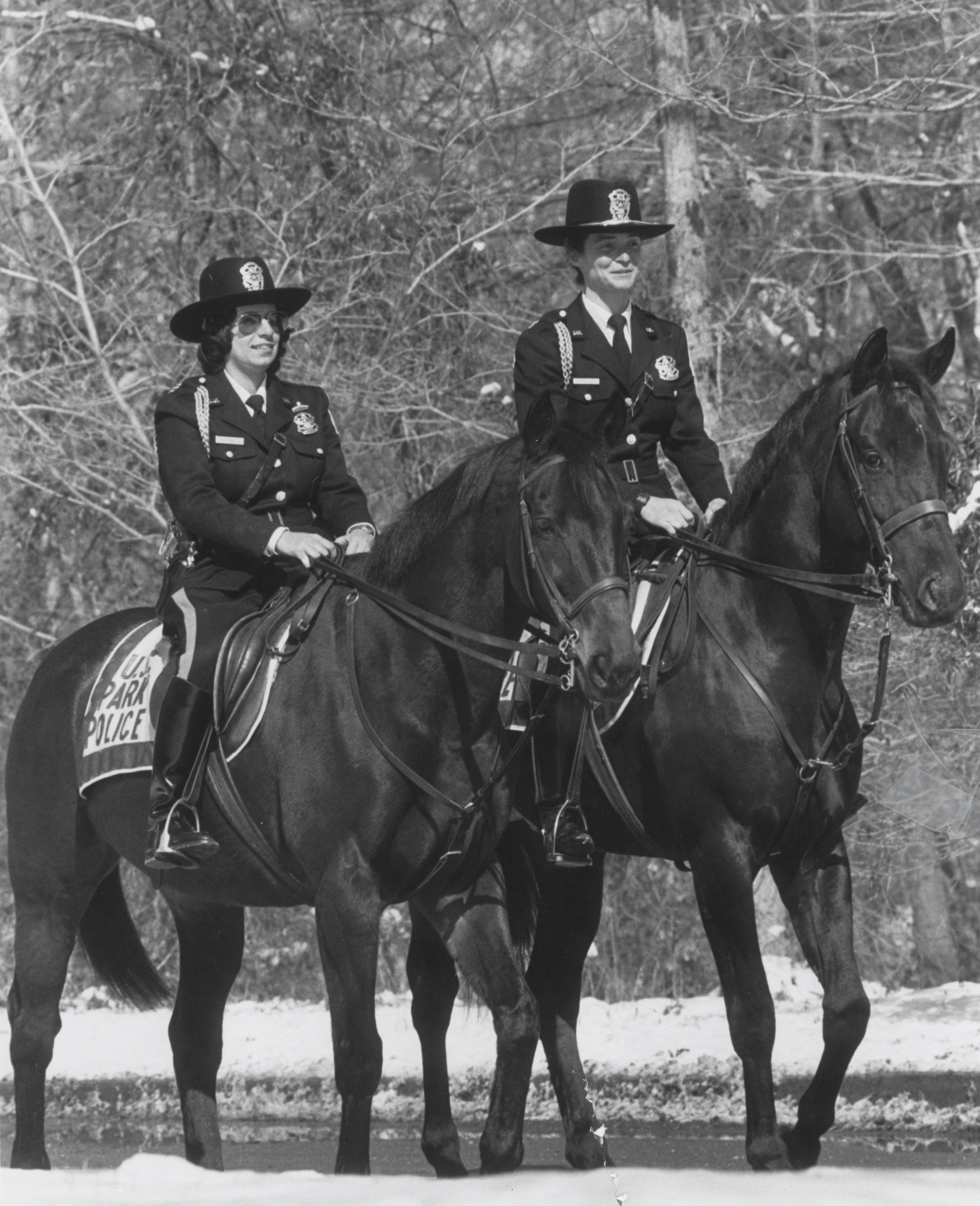 Valerie Fernandes and Pepper Karansky wear their US Park Police uniforms as they ride their police horses. 