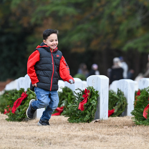 Child running through the cemetery.