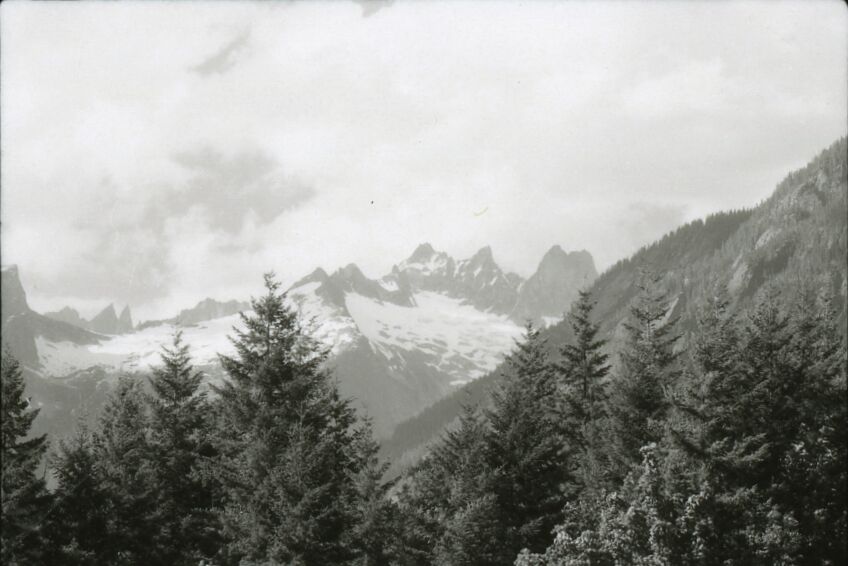 Aerial view of rocky mountains with some snow and ice.