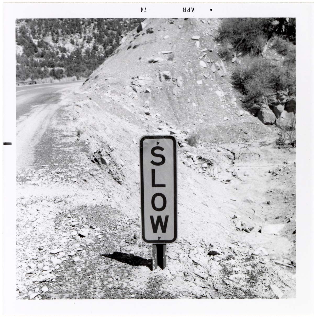 Road sign reading 'SLOW' in Kolob Canyon.