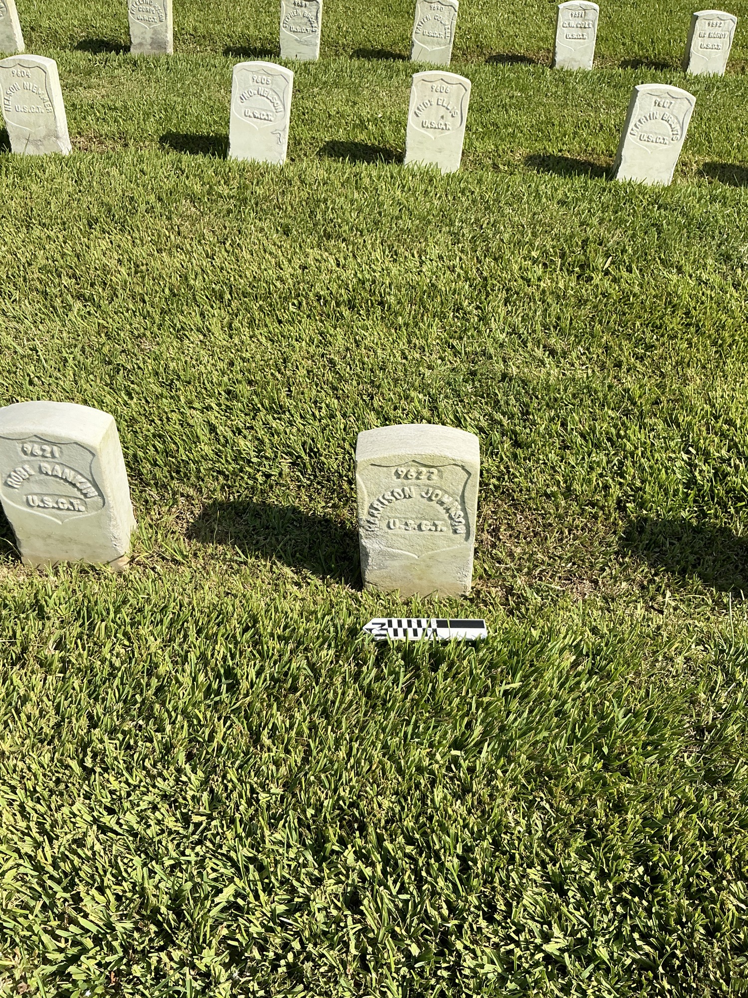 Extra image of historic upright marble headstone with recessed shield face.