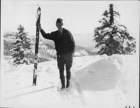 Holmes Leaning on Skis, Smiling. Arthur G. Holmes Collection Album 5: Holmes skiing near Lake Helen