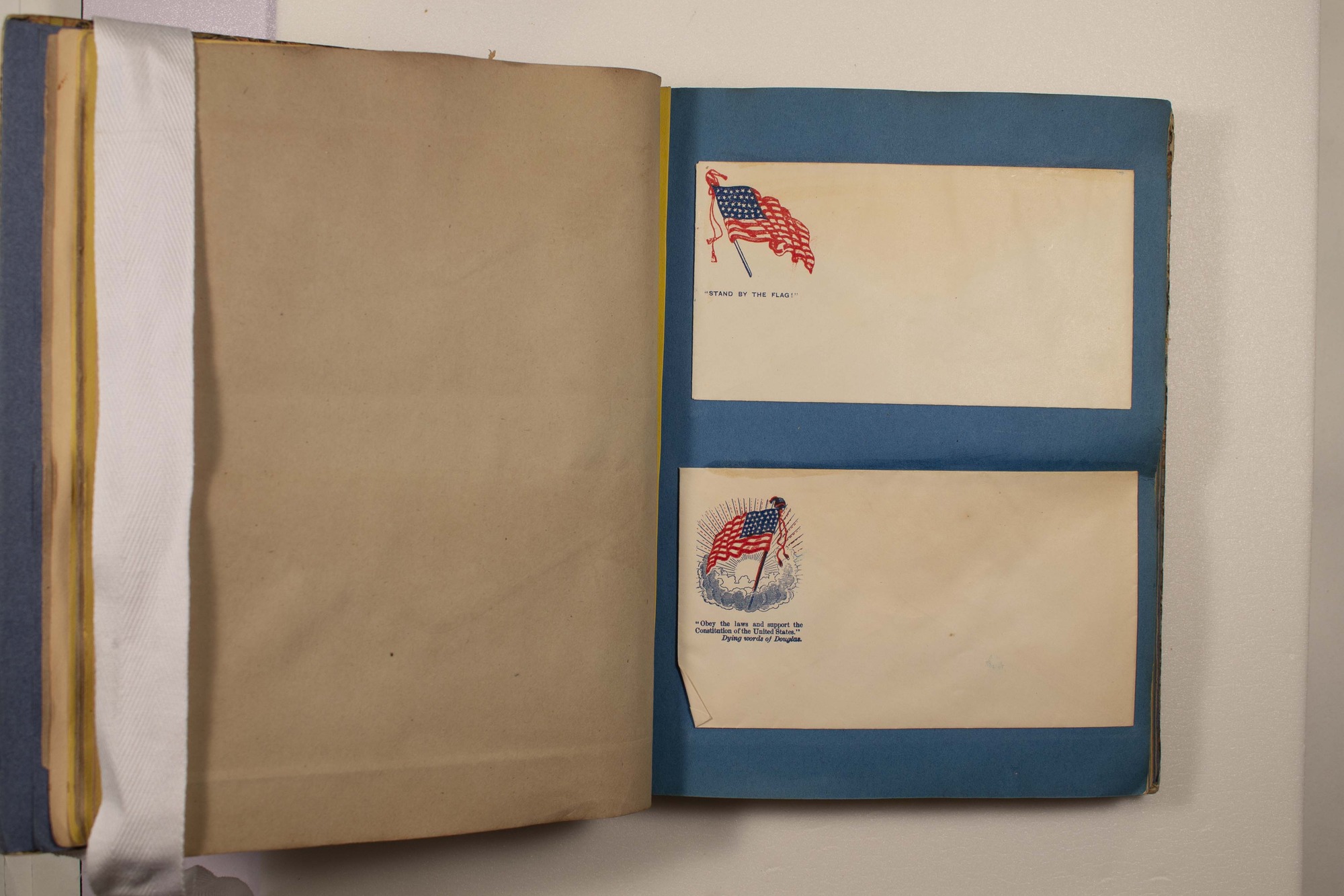 Back of two envelopes which have been glued to page.