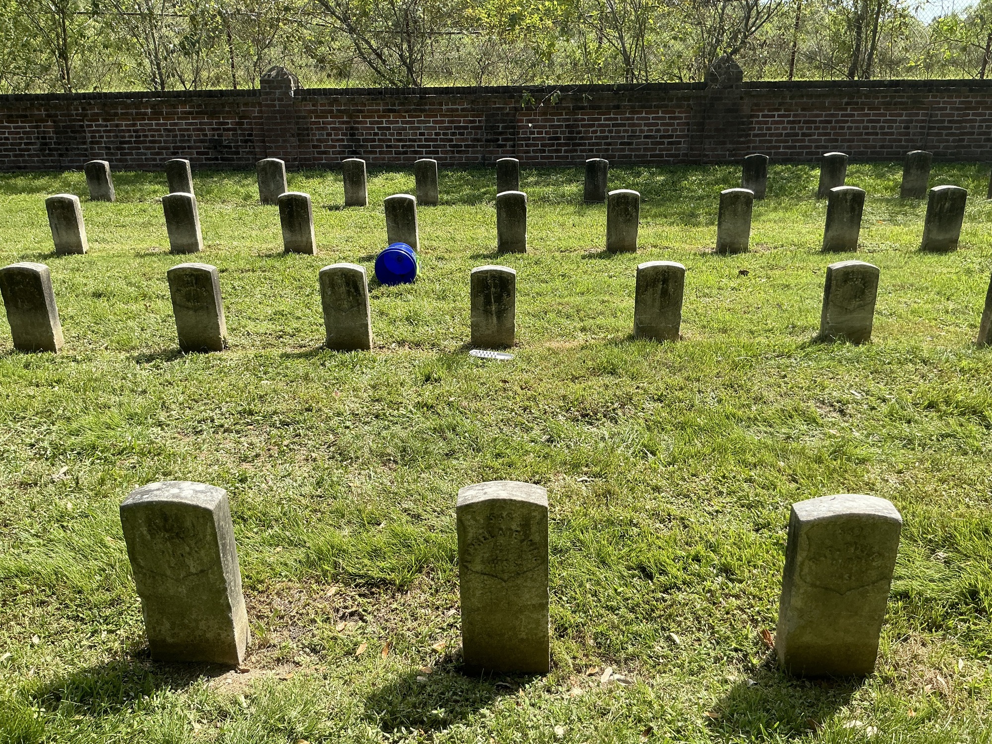 Extra image of historic upright marble headstone with recessed shield face.