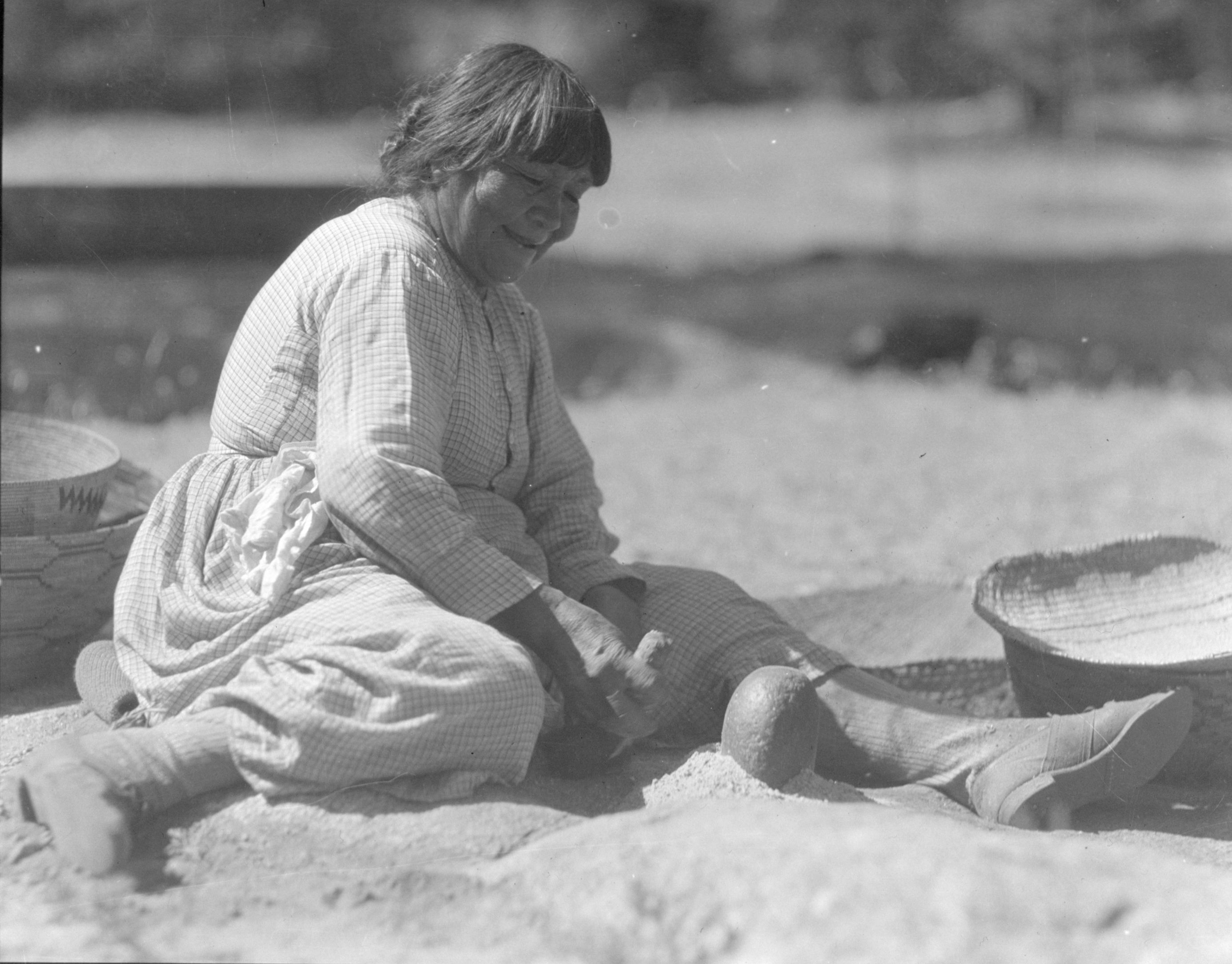 Ta-buce, Maggie, pounding acorns