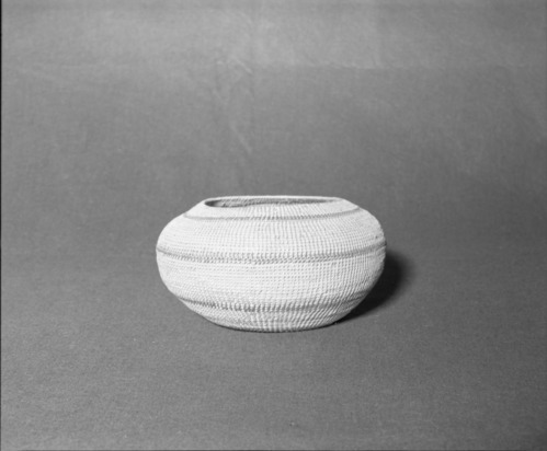 Mrs. Donald Segerstrom Collection. Object: Paiute or Washoe basket. Dimensions: 10 1/4 x 6". Materials: willow and commercially-dyed willow. Technology: single rod foundation, non-interlocking stitch, leftward coil direction, plain rim finish. Collection History: ---. Photographed of Michael Dixon, 1/83. Catalogued by Craig Bates and Barbara Beroza. Yosemite Collections, National Park Service.