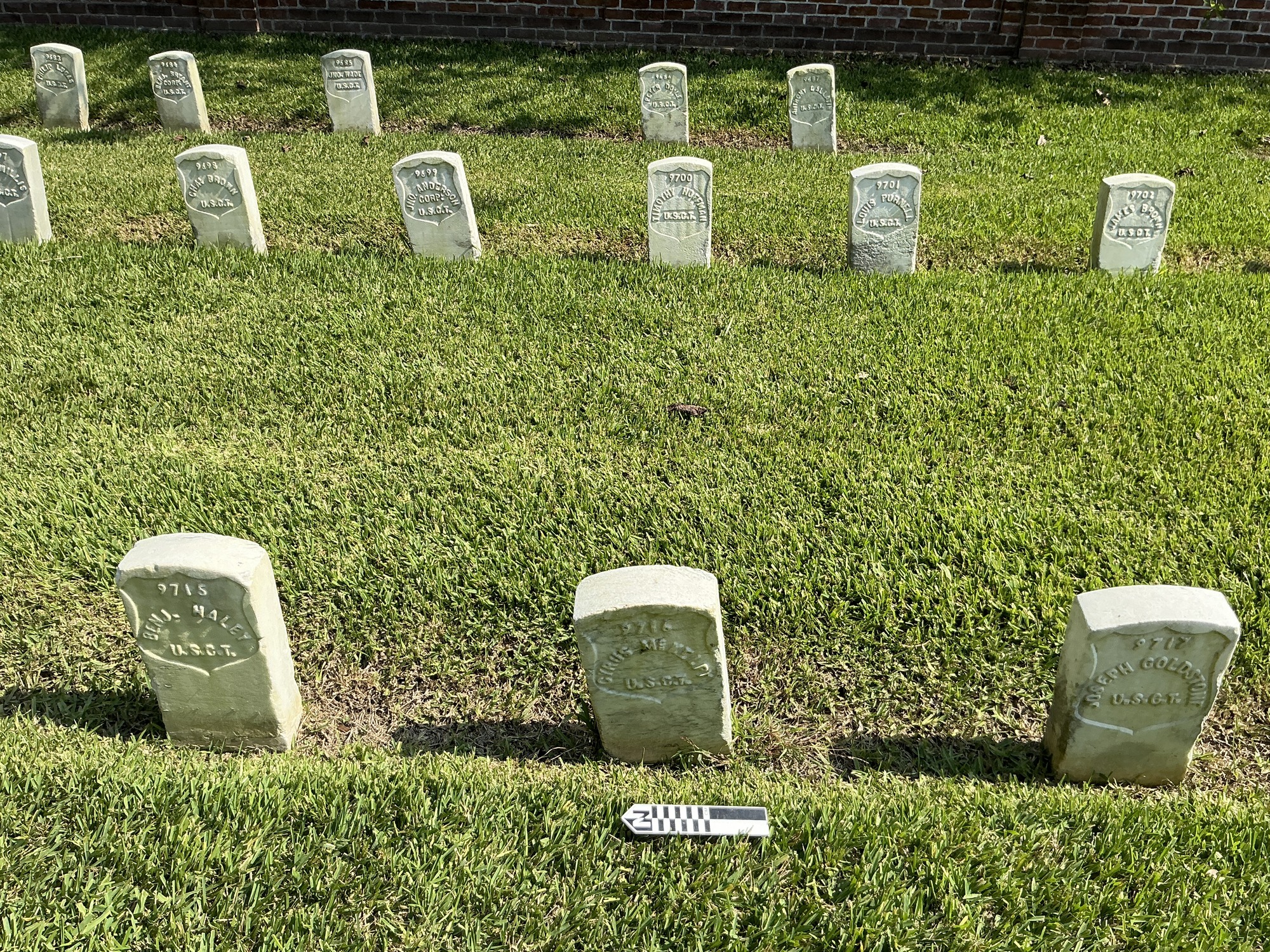 Extra image of historic upright marble headstone with recessed shield face.