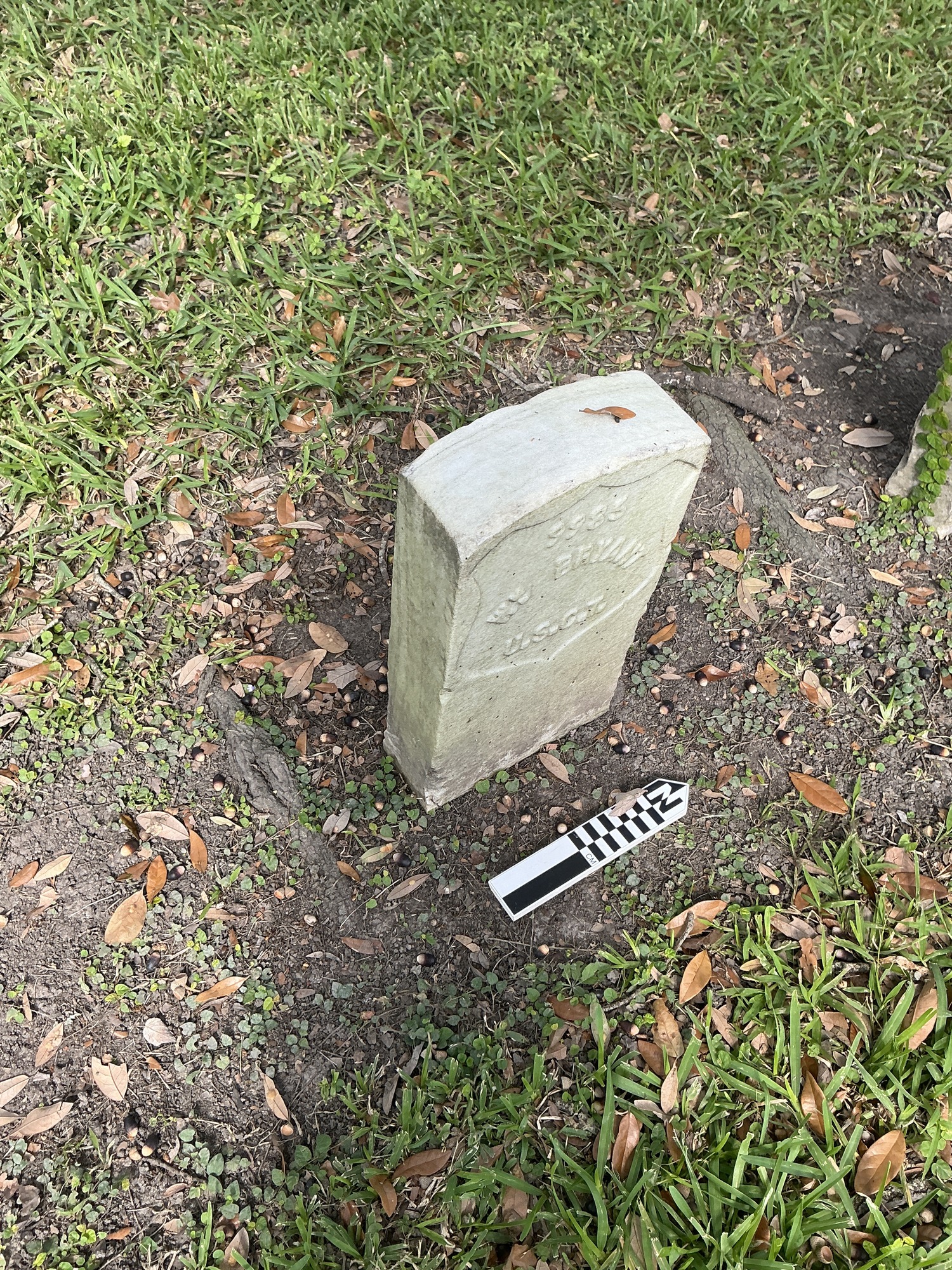 Extra image of historic upright marble headstone with recessed shield face.