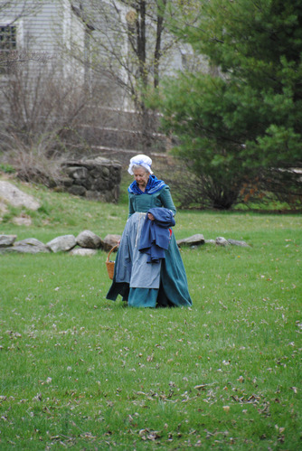 Reenactor volunteer, dressed in period clothing, portraying Mrs. Barrett