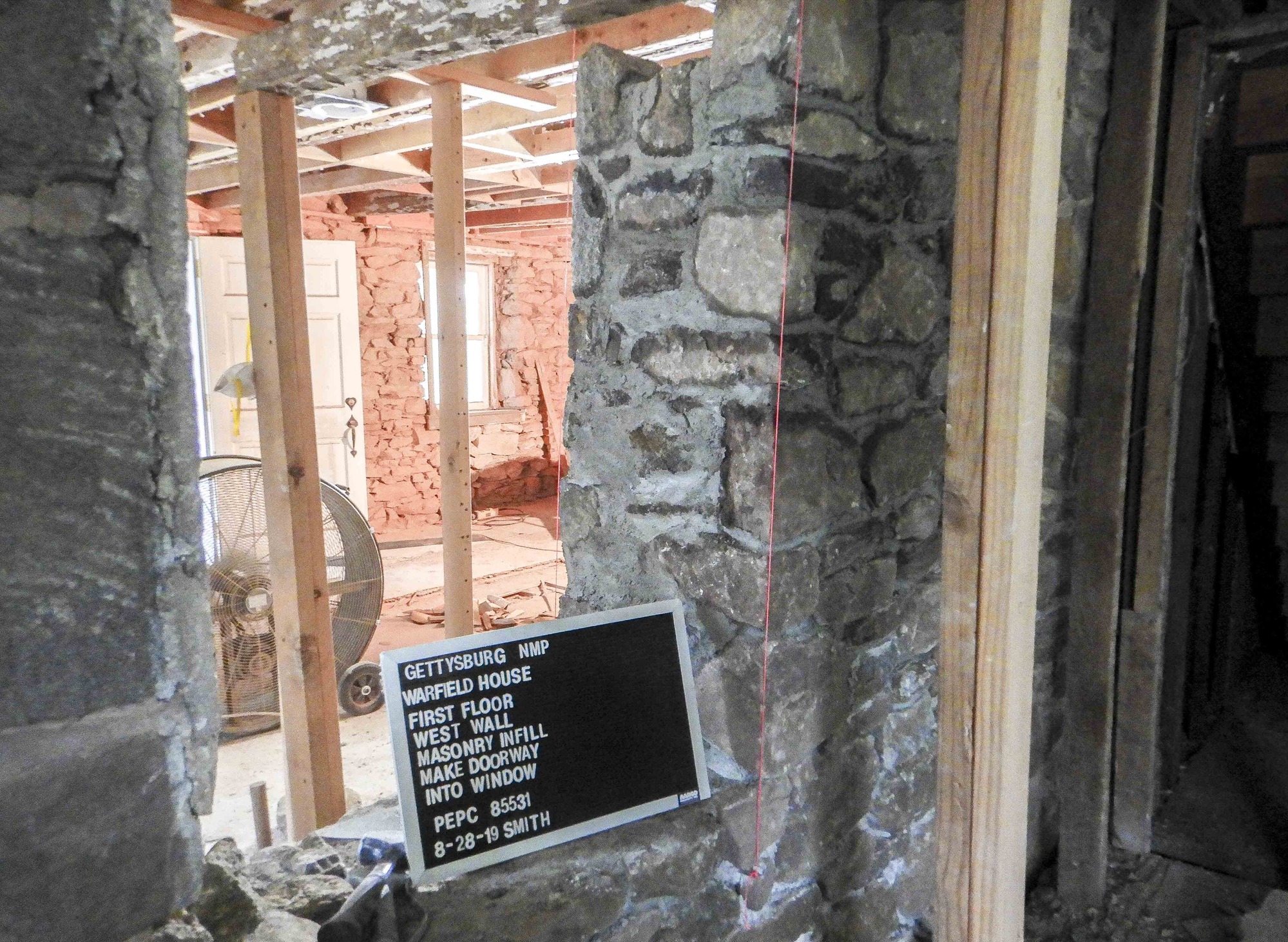 The window opening has been completed and the walls are straight and plumb.