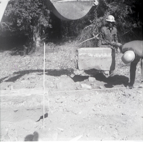 Men lowering rock while doing road work along the scenic canyon drive near the Grotto.