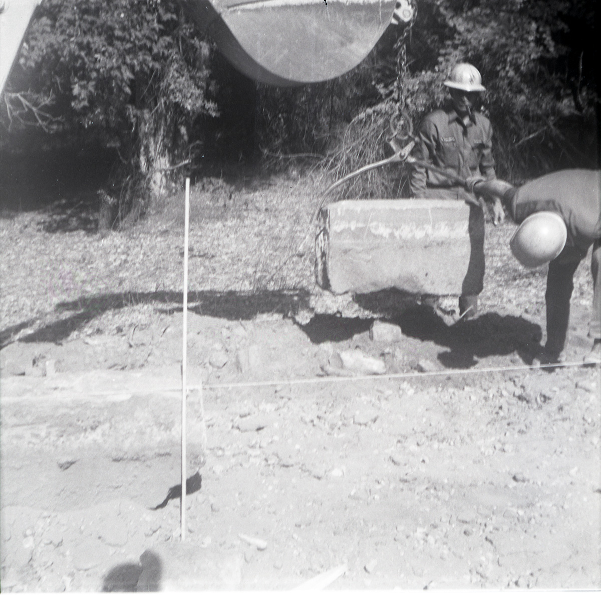 Men lowering rock while doing road work along the scenic canyon drive near the Grotto.