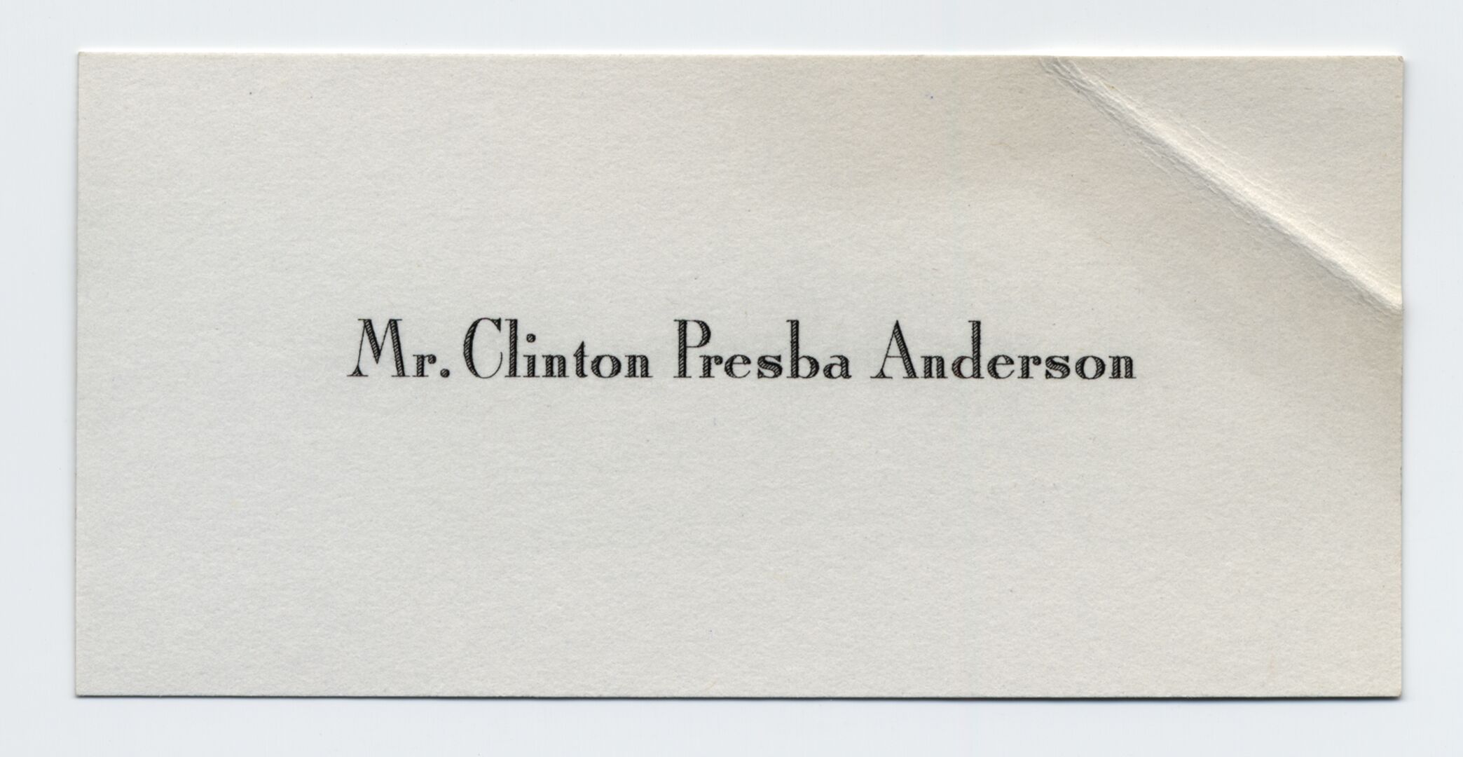 A small calling card with the visitor's name printed in the center.